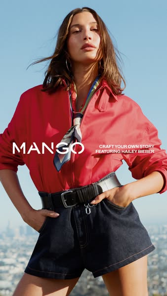 This Mango ad features Hailey Bieber modeling clothing from the brand. The image is a medium shot of Bieber set against 