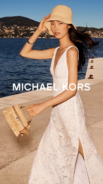 This ad features a lifestyle shot of a model wearing a white dress, holding a straw purse, and wearing a straw hat, next