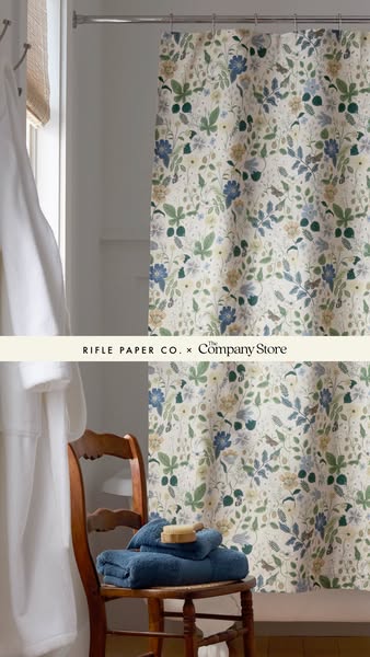 This image ad features a floral shower curtain and bathroom accessories from Rifle Paper Co. x The Company Store.