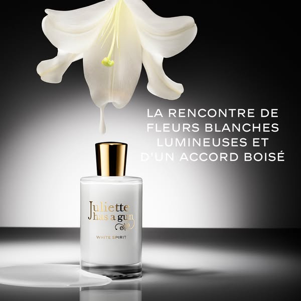 An image ad for Juliette has a gun "White Spirit" perfume that displays the bottle with liquid being poured on