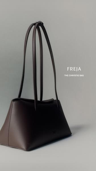 This ad features the Freja Chrystie Bag in a studio setting, showcasing its design and branding.