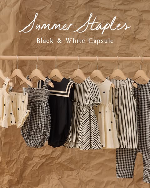 An ad for a children's clothing brand showcasing their new summer black and white capsule. The clothing items are hu