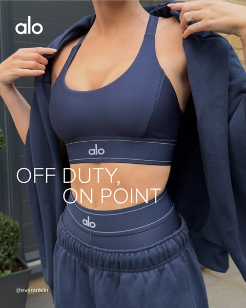 This ad features a person modeling Alo Yoga athleisure wear. The ad uses a brand hashtag.