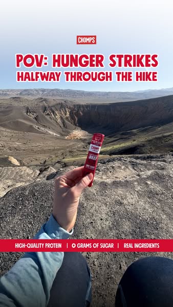 This image ad uses a first person point of view to highlight the perfect snack for hunger while on a hike. It highlights
