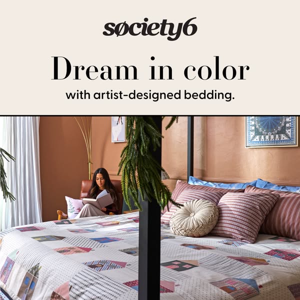 This ad for Society6 features a bedroom setting with a woman reading in bed. The focal point is artist-designed bedding,