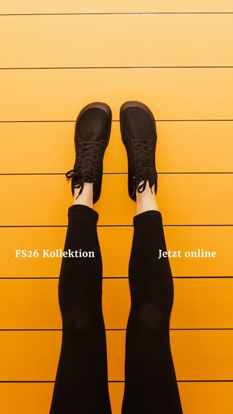 This ad showcases a pair of black lace-up shoes from a bird's eye view, suggesting they are part of the 'FS26 Ko