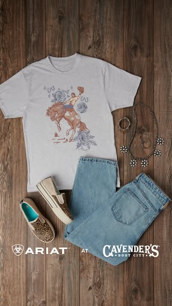 This image showcases a tee-shirt with a cowboy graphic from Ariat sold at Cavender's Boot City along with other acce