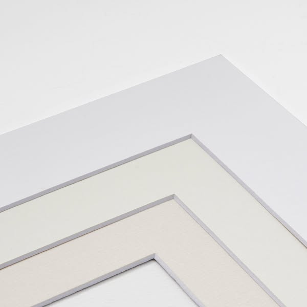 This ad features a close-up shot of a picture frame mat, showcasing its different layers and textures.