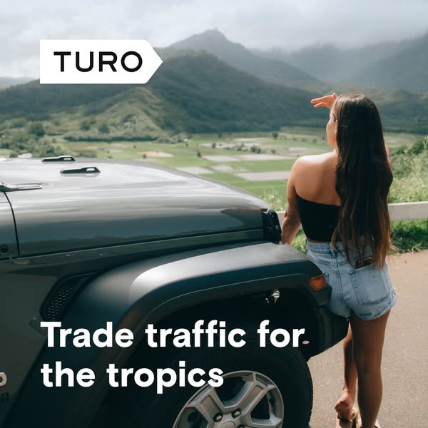 This ad for Turo features a woman standing next to a Jeep in front of a tropical landscape, suggesting that users can us