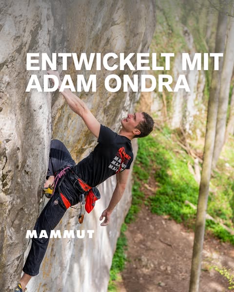 An image ad featuring a male rock climber scaled on a rocky cliff. The climber is wearing apparel from the brand MAMMUT,