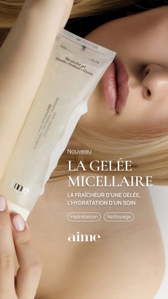 An ad featuring Aime's La Gelee Micellaire. It is a closeup shot of the product in the hand of a person. The ad high