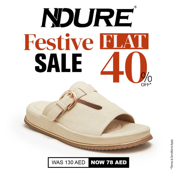 This image ad for NDURE features a single slide sandal with a block heel. Text overlays announce a festive flat sale of 