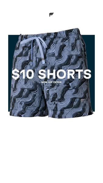 This ad features a pair of Fabletics shorts with a black and white wavy pattern, presented against a dark teal backdrop.