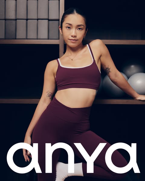 This ad features a woman wearing a matching activewear set from Anya. The ad focuses on the brand name and the model.