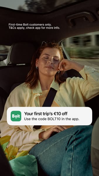 This image ad for Bolt promotes a discount for first-time users. It features a woman relaxing in the back of a car, with