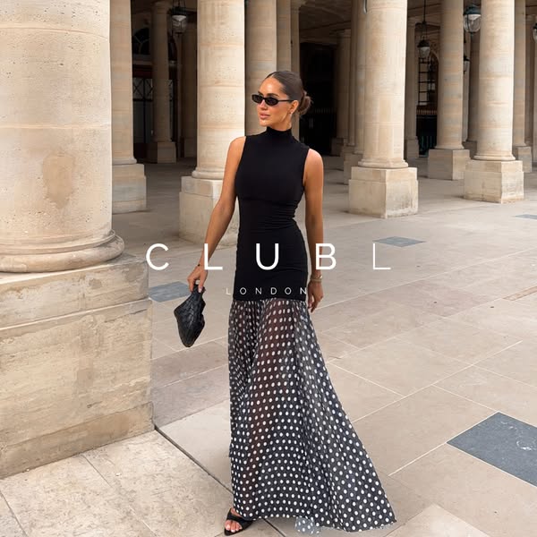 This ad features a woman wearing a sleeveless black dress with a polka-dot maxi skirt from Club London in what appears t