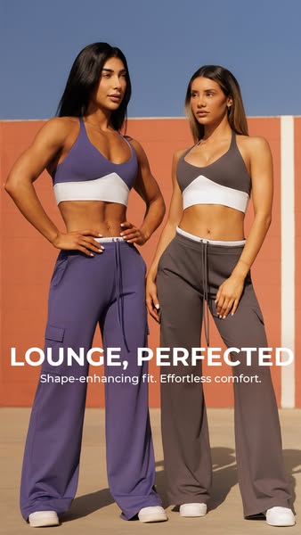 An image ad featuring two women modeling lounge wear, specifically sports bras and matching cargo pants. The ad emphasiz