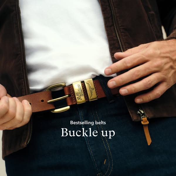 This ad showcases a man wearing a R.M. Williams leather belt. The focus is on the belt buckle and the brand logo.