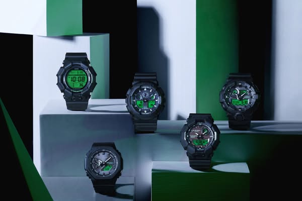 A product ad showcasing G-Shock watches on platforms and geometric shapes.