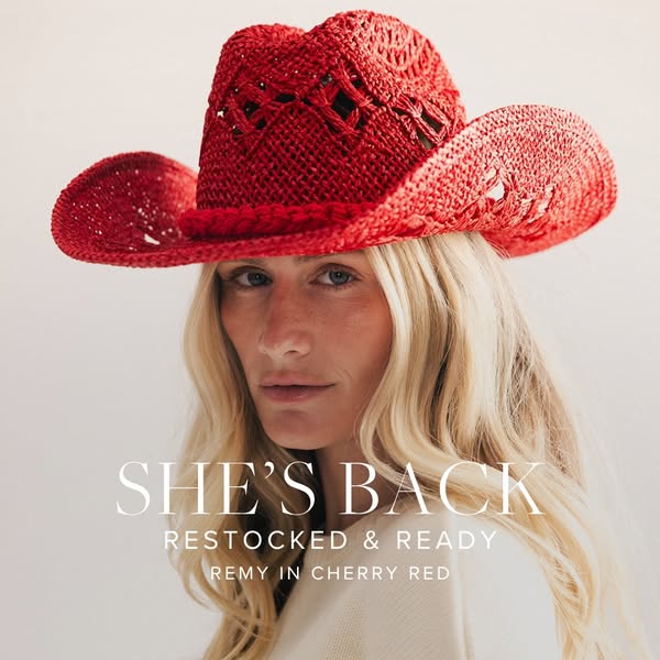 Image ad featuring a woman wearing a red woven cowboy hat with the text overlay: "SHE'S BACK. RESTOCKED & R