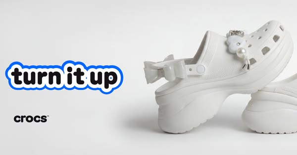 This ad features an image of a pair of platform Crocs on a white background. The ad’s headline is "turn it up"