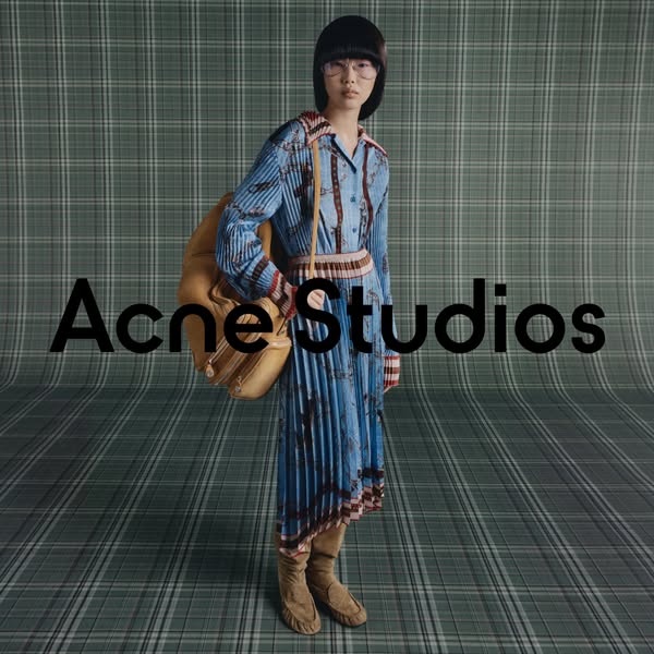 This ad features a model wearing a blue patterned dress, carrying a tan bag, and wearing tan boots. The brand name, Acne