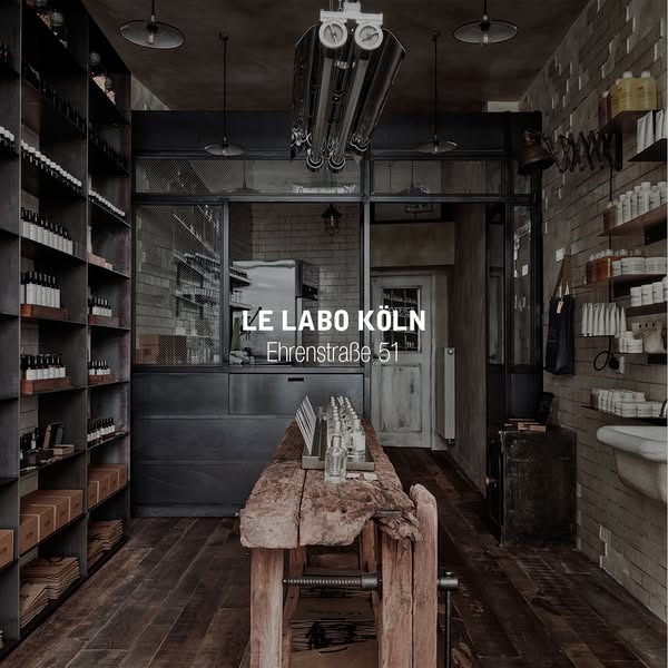 This ad showcases the interior of a Le Labo store in Cologne, Germany, emphasizing the brand's unique retail environ