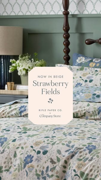 This ad showcases the "Strawberry Fields" bedding set from Rifle Paper Co. x The Company Store, now available 