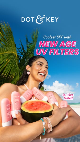 This image ad for Dot & Key sunscreen features a smiling model surrounded by multiple sunscreen bottles and a halved
