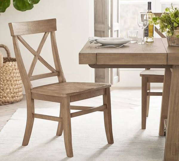 This ad showcases a wooden dining room chair with an X-shaped back. The chair is part of a dining set, with a table part