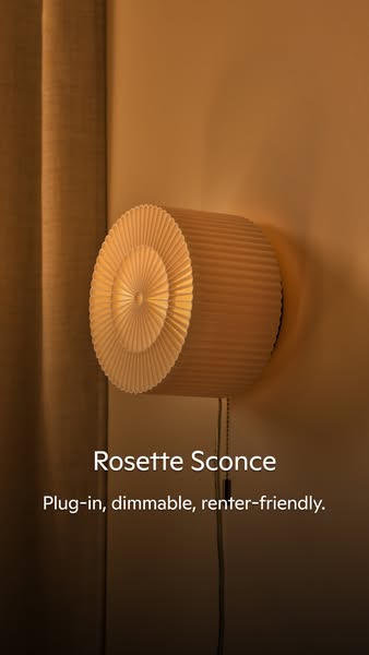This ad features a dimmable, plug-in rosette sconce that is renter-friendly.