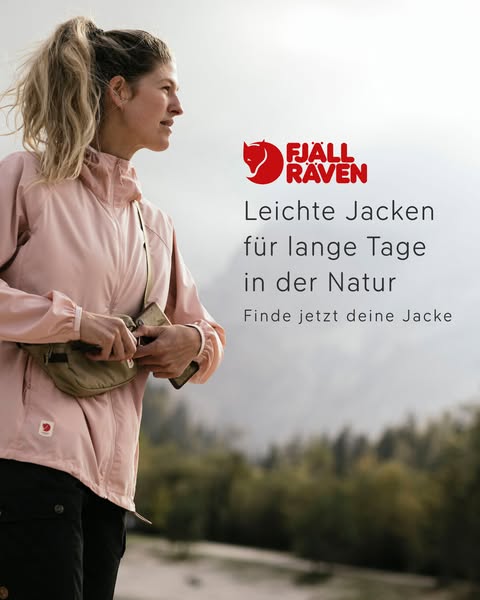 This image ad focuses on a Fjällräven lightweight jacket. A woman is wearing the jacket outdoors with nature in the back