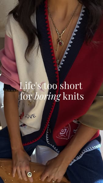 This image ad features a torso-level shot of a person wearing a multicolored cardigan sweater, accessorized with layered