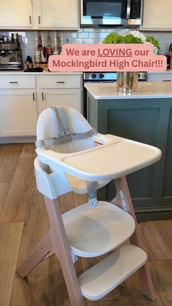 This ad features an image of the Mockingbird High Chair in a home kitchen setting, with a pink banner stating, "We 