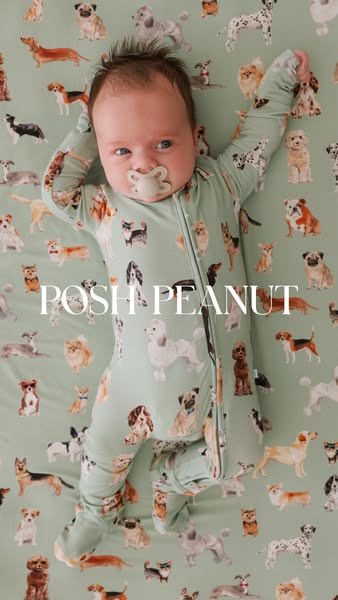 An overhead shot features a baby wearing a Posh Peanut romper. The baby is laying on a matching blanket. Both the romper