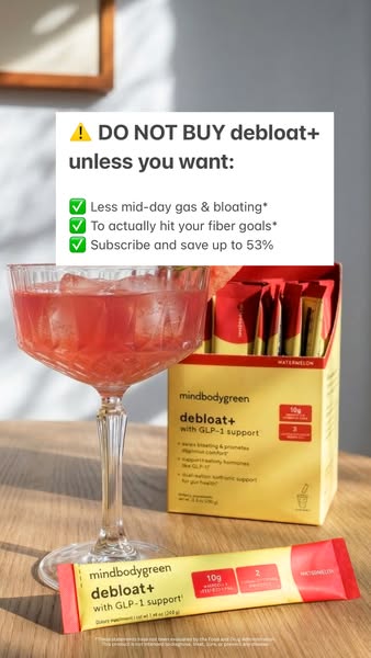 Image ad promoting mindbodygreen's debloat+ supplement. The ad features the product alongside a cocktail glass fille
