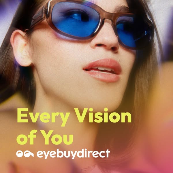 This image ad for eyebuydirect features a close-up of a woman wearing a pair of brown-framed sunglasses with blue lenses