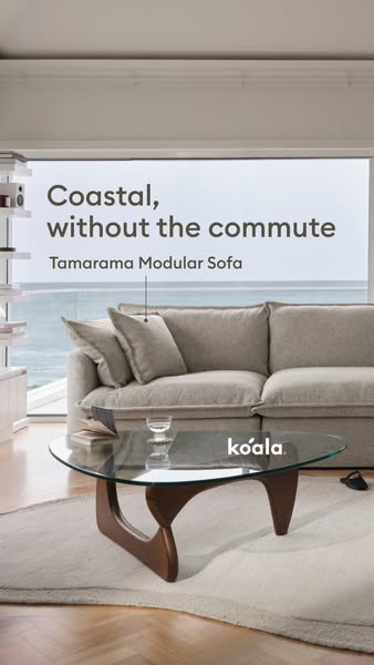 Ad for a modular sofa that shows it in a room with a coastal view.