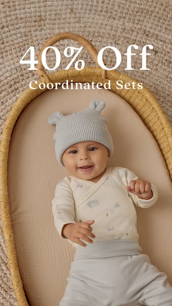 This image ad promotes coordinated baby clothing sets with a 40% discount. It features a smiling baby wearing a matching