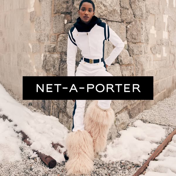 This ad features a woman in a white ski suit and furry boots standing in the snow. The ad promotes Net-A-Porter.