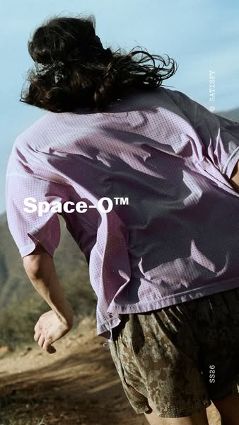 This ad features an individual in athletic apparel running in a mountainous terrain. The brand SATISFY is featured, alon