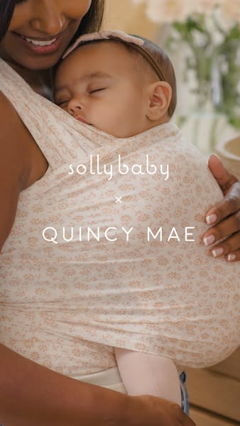An image ad promoting a collaborative baby wrap by Solly Baby and Quincy Mae. The ad features a woman of color wearing t