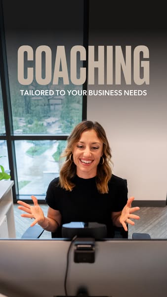 This ad promotes business coaching services. It features a woman smiling and gesturing in front of a computer, with text