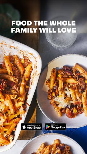 This image ad promotes a food app that provides recipes for family meals. The ad features a close-up shot of a pasta bak