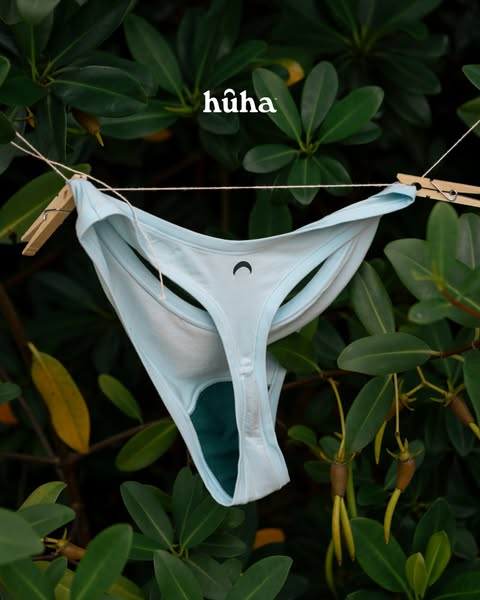 This ad showcases a Huha brand underwear that is made of Tencel. The underwear is hung up to dry outdoors.