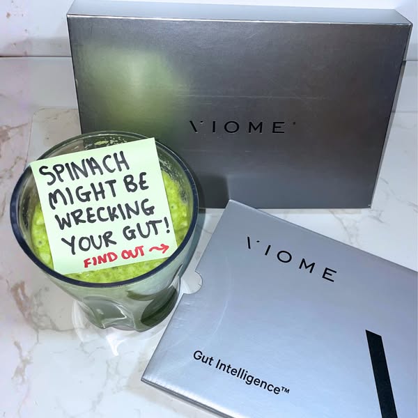 This ad is for Viome Gut Intelligence. A green smoothie sits next to a note saying 'Spinach might be wrecking your g