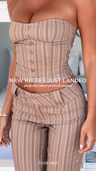 This image ad from Tiger Mist showcases a matching striped tube top and pants set, promoting their new arrivals.