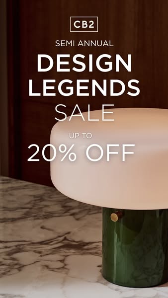 This image ad for CB2 promotes its Semi Annual Design Legends Sale, offering up to 20% off. The ad features a stylish ta
