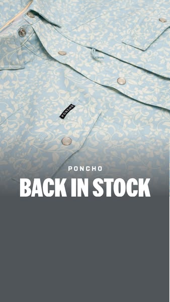 This ad features a close-up shot of a light blue button-down shirt with a white floral pattern. The text overlay announc