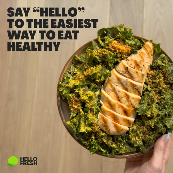 This image ad for HelloFresh features a close-up shot of a kale salad with grilled chicken, emphasizing the ease of eati